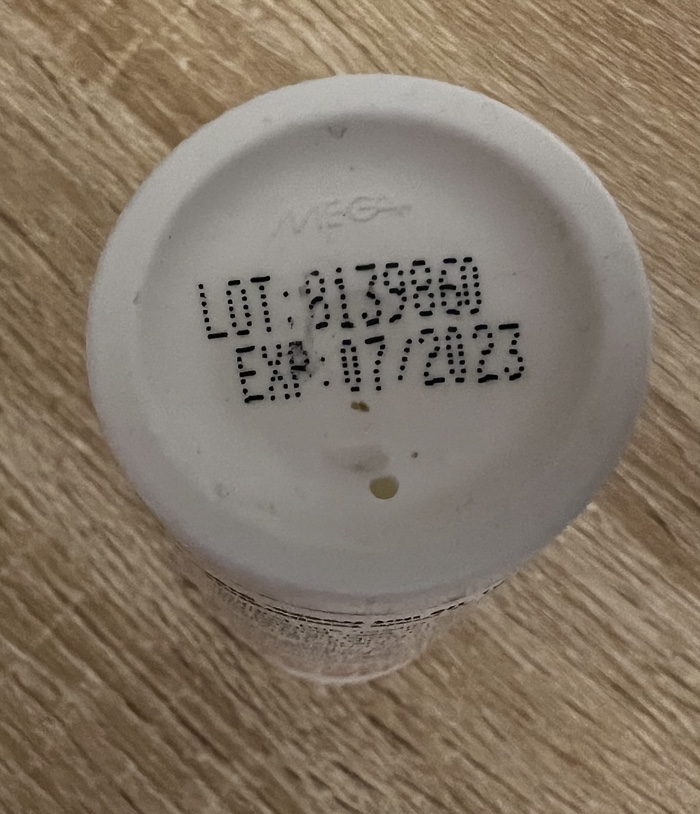 A picture showing expiration date on the bottom of bottle